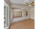 Open-concept living room showcasing wood flooring and natural light at 302 Old Mulrennan Rd, Valrico, FL 33594