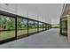 Screened-in patio offering views of the backyard at 302 Old Mulrennan Rd, Valrico, FL 33594