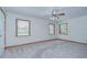 Bright bedroom with three windows offering ample natural light at 3125 S Miller Rd, Valrico, FL 33596