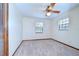 Bright bedroom with a ceiling fan, plush carpet and closet space at 3125 S Miller Rd, Valrico, FL 33596