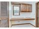Home office featuring built in cabinets, countertop, and natural light at 3125 S Miller Rd, Valrico, FL 33596