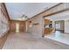 Brick sunroom featuring brick accent wall and bar with access to kitchen at 3125 S Miller Rd, Valrico, FL 33596