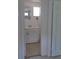 Bathroom sink and mirror with tile flooring as seen through a doorway at 3131 Melton N St, St Petersburg, FL 33704