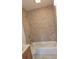 Tiled shower over tub in a bathroom setting at 3131 Melton N St, St Petersburg, FL 33704