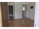 View of open bedroom layout, featuring access to an attached bathroom and view of an additional room at 3131 Melton N St, St Petersburg, FL 33704
