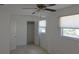 Bedroom featuring neutral tile, closet, ceiling fan, and bright natural light at 3131 Melton N St, St Petersburg, FL 33704
