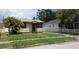 Charming single-story home with a well-manicured lawn and landscaping, creating a welcoming curb appeal at 3131 Melton N St, St Petersburg, FL 33704