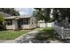 Charming single-story home with horizontal siding, shutters, and a well-maintained lawn and landscaping at 3131 Melton N St, St Petersburg, FL 33704