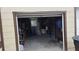 View of the garage interior with an assortment of tools, ladders, household items and overhead storage at 3131 Melton N St, St Petersburg, FL 33704