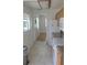Efficient kitchen layout with modern appliances, tile flooring, and ample natural light at 3131 Melton N St, St Petersburg, FL 33704