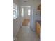 Well-lit kitchen showcasing modern appliances, tile flooring, and convenient layout at 3131 Melton N St, St Petersburg, FL 33704