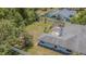 Aerial view of the property showing the backyard, enclosed patio, and boundary fencing at 3144 Abeline Rd, Spring Hill, FL 34608