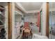 View of the bathroom with double sinks, tub, and an adjacent walk-in closet at 3144 Abeline Rd, Spring Hill, FL 34608