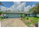 Charming single-story home with a two-car garage and a lush green yard at 3144 Abeline Rd, Spring Hill, FL 34608