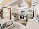 Kitchen view with white appliances and cabinets, stainless steel oven, and tiled backsplash at 3144 Abeline Rd, Spring Hill, FL 34608