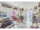 Bright living room with tiled floors, large windows and sliding glass doors for natural lighting at 3144 Abeline Rd, Spring Hill, FL 34608