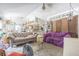 Spacious living room featuring carpet flooring and a ceiling fan at 3144 Abeline Rd, Spring Hill, FL 34608