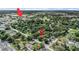 Aerial view of the home's location within a lush, green neighborhood, conveniently near commercial areas at 3205 68Th N Ave, St Petersburg, FL 33702