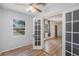 Bright room with wood-look floors, ceiling fan and large window, perfect for a bedroom or home office at 3205 68Th N Ave, St Petersburg, FL 33702