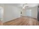 Inviting living room with wood-look floors, a ceiling fan and arched doorways at 3205 68Th N Ave, St Petersburg, FL 33702