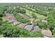 Picturesque aerial view of a neighborhood set against a backdrop of lush greenery, mature trees and a golf course at 3506 Cordgrass Dr, Valrico, FL 33596