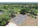 Outdoor basketball court surrounded by trees, offering a great space for recreational games and skill practice at 3506 Cordgrass Dr, Valrico, FL 33596