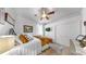 Bright bedroom with a ceiling fan, closet and comfortable, neutral decor at 3506 Cordgrass Dr, Valrico, FL 33596