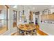 Charming dining area featuring a wood table with a decorative rug and large windows for natural light at 3506 Cordgrass Dr, Valrico, FL 33596