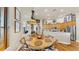 Charming dining area featuring a wood table with a decorative rug and large windows for natural light at 3506 Cordgrass Dr, Valrico, FL 33596