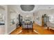 Elegant dining area with hardwood floors, stylish decor, and modern lighting fixtures at 3506 Cordgrass Dr, Valrico, FL 33596