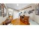 Hallway with hardwood floors, cabinet, and decorative elements on the wall at 3506 Cordgrass Dr, Valrico, FL 33596