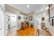 Hallway with hardwood floors, cabinet, and access to a bathroom at 3506 Cordgrass Dr, Valrico, FL 33596