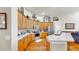 Kitchen with modern stainless steel appliances, wood cabinetry, and an island bar for dining at 3506 Cordgrass Dr, Valrico, FL 33596