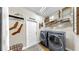 Modern laundry room with front-load washer and dryer at 3506 Cordgrass Dr, Valrico, FL 33596