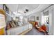 Large, serene main bedroom with seating area, tray ceilings and calming decor at 3506 Cordgrass Dr, Valrico, FL 33596