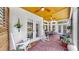 Covered porch with rocking chairs and outdoor decor at 3506 Cordgrass Dr, Valrico, FL 33596