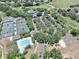 Expansive recreation area featuring a pool, tennis courts, a parking lot, and a playground for community enjoyment at 3506 Cordgrass Dr, Valrico, FL 33596