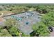 Aerial view showcasing multiple well-maintained tennis courts, providing ample space for players and tournaments at 3506 Cordgrass Dr, Valrico, FL 33596