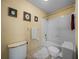 Standard bathroom featuring a bathtub with shower and a toilet at 37821 Willingham Ave, Dade City, FL 33525