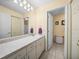 Bathroom featuring a vanity, a sink, and a shower at 37821 Willingham Ave, Dade City, FL 33525