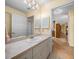 Neutral bathroom featuring white vanity with sink and a large mirror reflecting the space at 37821 Willingham Ave, Dade City, FL 33525