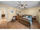 Relaxing bedroom with wood flooring and vintage wooden furniture at 37821 Willingham Ave, Dade City, FL 33525