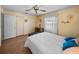 Bedroom features a ceiling fan, closets, and wood-look floor for a cozy feel at 37821 Willingham Ave, Dade City, FL 33525