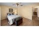 Bedroom with a wood-look floor and neutral walls offers a peaceful retreat at 37821 Willingham Ave, Dade City, FL 33525
