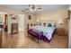 Inviting bedroom featuring a ceiling fan, and ensuite bathroom and a vanity seating area at 37821 Willingham Ave, Dade City, FL 33525