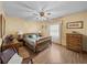 Relaxing bedroom with wood flooring, vintage furniture and large windows at 37821 Willingham Ave, Dade City, FL 33525