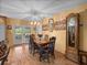 Charming dining area features a wooden table and chairs, and glass paneled doors at 37821 Willingham Ave, Dade City, FL 33525
