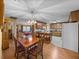 Bright eat in kitchen with wooden cabinets and a dining table at 37821 Willingham Ave, Dade City, FL 33525