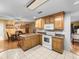 The kitchen features oak cabinets, white appliances, and an electric range at 37821 Willingham Ave, Dade City, FL 33525