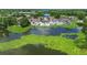 Aerial view of community with lake and lush landscaping at 3805 Cortez Cir # B, Tampa, FL 33614